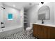 Modern bathroom features black and white patterned tile and updated fixtures at 528 Pumpkinvine Rd, Acworth, GA 30101
