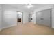 Spacious bedroom featuring neutral carpet, ceiling fan, and an attached bathroom at 528 Pumpkinvine Rd, Acworth, GA 30101