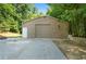 Spacious garage with roll up door and plenty of parking space at 528 Pumpkinvine Rd, Acworth, GA 30101