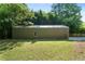 Exterior view of garage in backyard surrounded by green grass at 528 Pumpkinvine Rd, Acworth, GA 30101