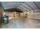 Large, empty garage with plenty of space for storage or workshop activities at 528 Pumpkinvine Rd, Acworth, GA 30101