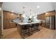 Spacious kitchen with stainless steel appliances, custom cabinets, a large island, and pendant lighting at 528 Pumpkinvine Rd, Acworth, GA 30101