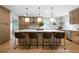 Modern kitchen with an island, pendant lights, and stainless steel appliances at 528 Pumpkinvine Rd, Acworth, GA 30101
