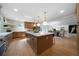 Spacious kitchen with large center island, hardwood floors, and modern appliances at 528 Pumpkinvine Rd, Acworth, GA 30101