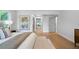 Bright main bedroom with hardwood floors, neutral decor, and lots of natural light at 528 Pumpkinvine Rd, Acworth, GA 30101