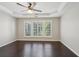 Spacious bedroom with tray ceiling, ceiling fan, and lots of natural light at 6755 Waveland Dr, Cumming, GA 30040