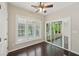 Bedroom with large windows, ceiling fan, and access to a screened-in porch at 6755 Waveland Dr, Cumming, GA 30040