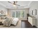 Bedroom featuring a tray ceiling, ceiling fan, and large windows at 6755 Waveland Dr, Cumming, GA 30040