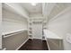 Walk-in closet with shelves and hanging rods at 6755 Waveland Dr, Cumming, GA 30040