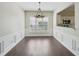Formal dining room with plantation shutters and hardwood floors at 6755 Waveland Dr, Cumming, GA 30040