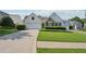 Charming one-story home with a manicured lawn, two-car garage, and stone detailing at 6755 Waveland Dr, Cumming, GA 30040