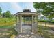 Charming community gazebo offers a serene spot overlooking a picturesque pond at 6755 Waveland Dr, Cumming, GA 30040