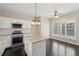 Bright kitchen features an island, stainless appliances, and plenty of cabinet space at 6755 Waveland Dr, Cumming, GA 30040