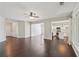 Open concept living room with hardwood floors and kitchen access at 6755 Waveland Dr, Cumming, GA 30040