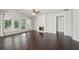 Bright living room with hardwood floors, fireplace, and plenty of natural light at 6755 Waveland Dr, Cumming, GA 30040