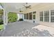 Covered patio featuring ceiling fans and a concrete floor, perfect for outdoor entertaining at 6755 Waveland Dr, Cumming, GA 30040