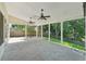 Large covered patio with ceiling fans provides a comfortable outdoor living space at 6755 Waveland Dr, Cumming, GA 30040