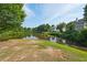 Picturesque pond surrounded by lush greenery, creating a serene and natural setting at 6755 Waveland Dr, Cumming, GA 30040