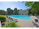 Inviting community pool surrounded by lush greenery and comfortable lounge chairs at 6755 Waveland Dr, Cumming, GA 30040