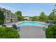 A beautiful community pool with ample seating for residents to relax and enjoy sunny days at 6755 Waveland Dr, Cumming, GA 30040