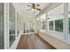 Covered porch with screen and ceiling fan at 6755 Waveland Dr, Cumming, GA 30040