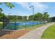 Community tennis court provides a recreational amenity for active residents to enjoy at 6755 Waveland Dr, Cumming, GA 30040