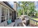 Relaxing back deck with outdoor seating and lush greenery, great for entertaining at 70 Maplewood Ln, Acworth, GA 30101