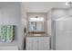 Bathroom features a granite vanity top, tub/shower combo, and ample lighting at 70 Maplewood Ln, Acworth, GA 30101
