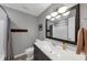 Cozy bathroom featuring a sleek vanity, modern lighting, and a shower with neutral-toned curtain at 70 Maplewood Ln, Acworth, GA 30101