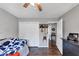 Bright bedroom with hardwood floors, closet with white doors, and a cozy daybed at 70 Maplewood Ln, Acworth, GA 30101