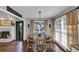 Dining area with fireplace and hardwood floors and view to the yard at 70 Maplewood Ln, Acworth, GA 30101