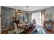 Inviting dining room with stylish decor and a long wooden table perfect for Gathering gatherings at 70 Maplewood Ln, Acworth, GA 30101
