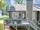 Back exterior with a deck, stairs, grill, and lovely outdoor space at 70 Maplewood Ln, Acworth, GA 30101