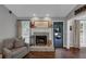 Close up of the fireplace with white mantle, brick surround, and decor at 70 Maplewood Ln, Acworth, GA 30101