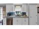 Kitchen with granite counters, stainless appliances, and white cabinets at 70 Maplewood Ln, Acworth, GA 30101