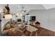 Cozy living room with vaulted ceilings, ceiling fan, fireplace, and wood floors at 70 Maplewood Ln, Acworth, GA 30101