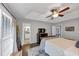 Bright and spacious main bedroom featuring a tray ceiling, dark wood furniture, and lots of natural light at 70 Maplewood Ln, Acworth, GA 30101