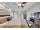 Bright main bedroom featuring ample natural light, neutral decor, and en-suite bath at 70 Maplewood Ln, Acworth, GA 30101