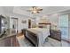 Serene main bedroom with a tray ceiling, dark wood furniture, and plush bedding at 70 Maplewood Ln, Acworth, GA 30101