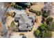 A captivating aerial view highlights the meticulously landscaped yard and the home's architectural roofline at 1037 Windermere Xing, Cumming, GA 30041