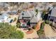 Aerial view of a well-maintained home with a spacious backyard and outdoor deck at 1037 Windermere Xing, Cumming, GA 30041