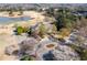 Aerial view of clubhouse overlooking a golf course, lake, and landscaped grounds at 1037 Windermere Xing, Cumming, GA 30041