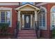 Elegant brick front entrance featuring a decorative front door with sidelights at 1037 Windermere Xing, Cumming, GA 30041