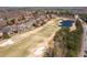 Expansive golf course view with a tranquil pond, sand traps and lush greenery at 1037 Windermere Xing, Cumming, GA 30041