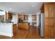 Well-equipped kitchen features custom wood cabinetry, stainless appliances and a hardwood floor at 1037 Windermere Xing, Cumming, GA 30041