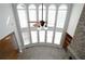 Spacious living room with tall windows and a soaring ceiling that fills the space with natural light at 1037 Windermere Xing, Cumming, GA 30041