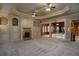 Spacious living room with fireplace, built-in cabinets, and arched entryways at 1037 Windermere Xing, Cumming, GA 30041