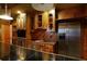 Wet bar with stainless steel refrigerator and rustic wood cabinetry at 1037 Windermere Xing, Cumming, GA 30041