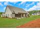 Well-maintained home with a lush green lawn and covered patio, offering a perfect blend of indoor-outdoor living at 174 Vandiver Ct, Acworth, GA 30101