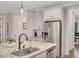 Kitchen with stainless steel appliances, granite countertops, and modern fixtures at 174 Vandiver Ct, Acworth, GA 30101